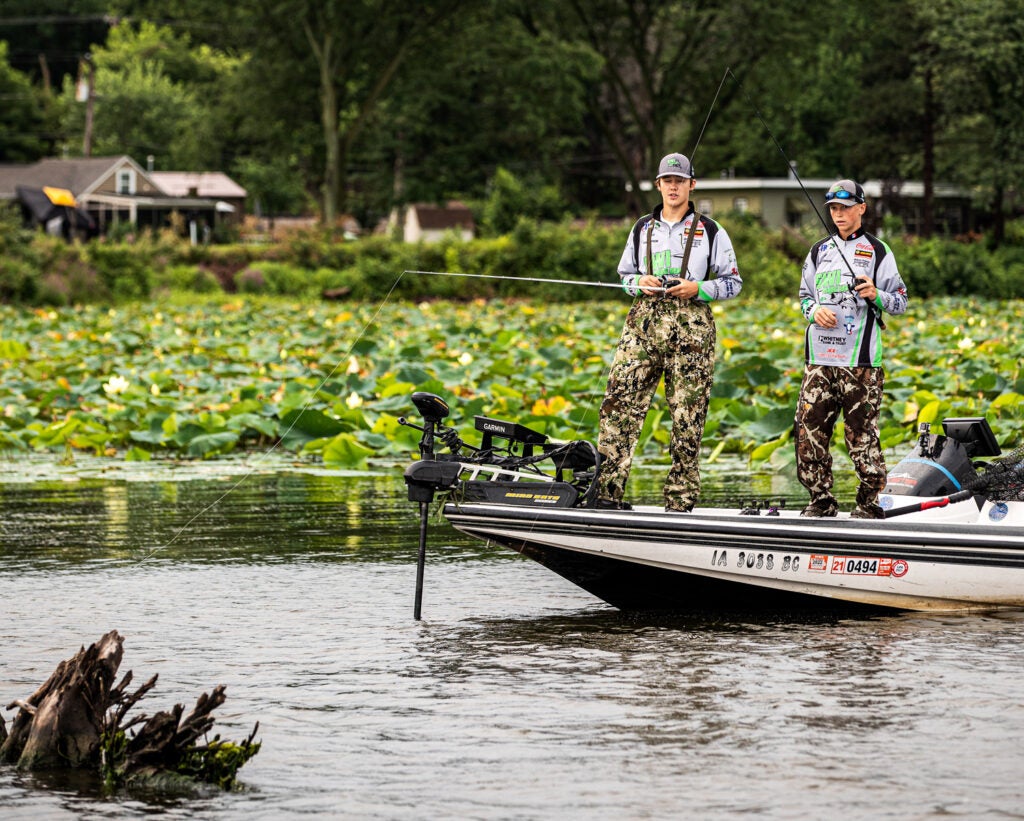 Two anglers fishing from boat