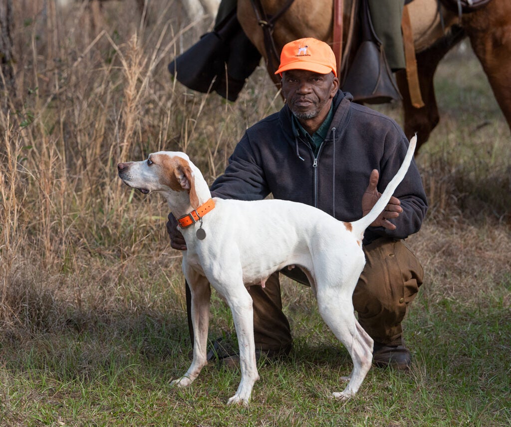 Handler Perris Brooks with pointer Cross Road Leah