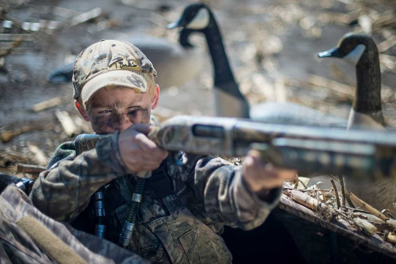 young hunter with shotgun