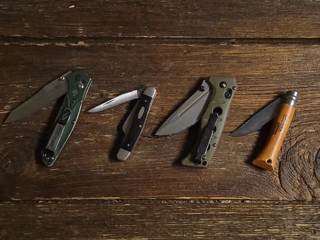 Four of the best pocket knives lined up.