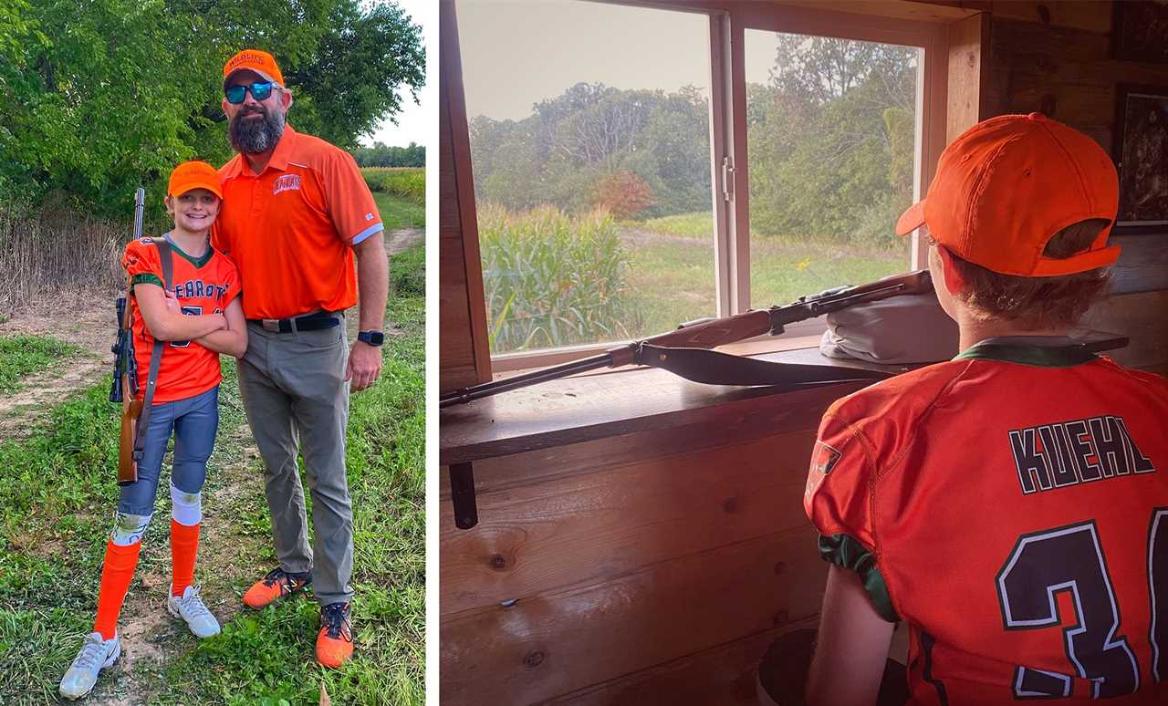 A young hunter dressed in a football uniform stands beside his dad before going hunting.