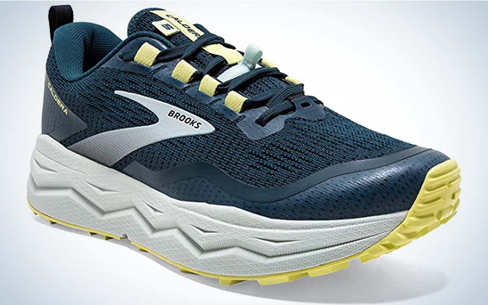 Blue running shoes with a white sole and yellow accents