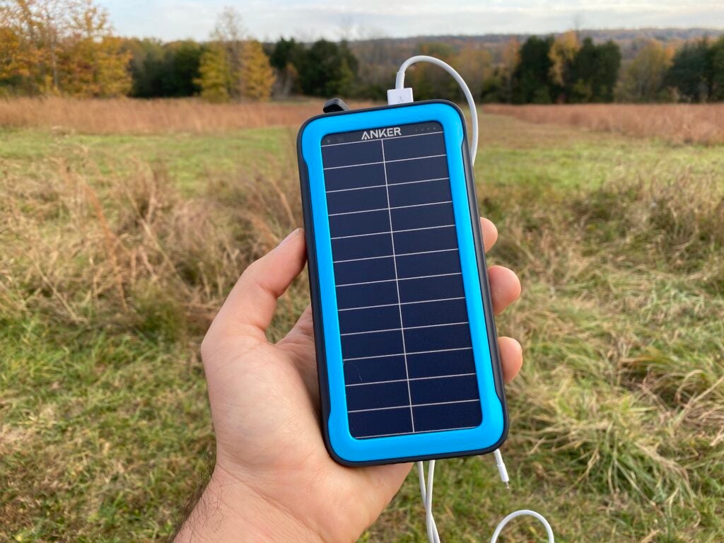 A person holding one of the best power banks.