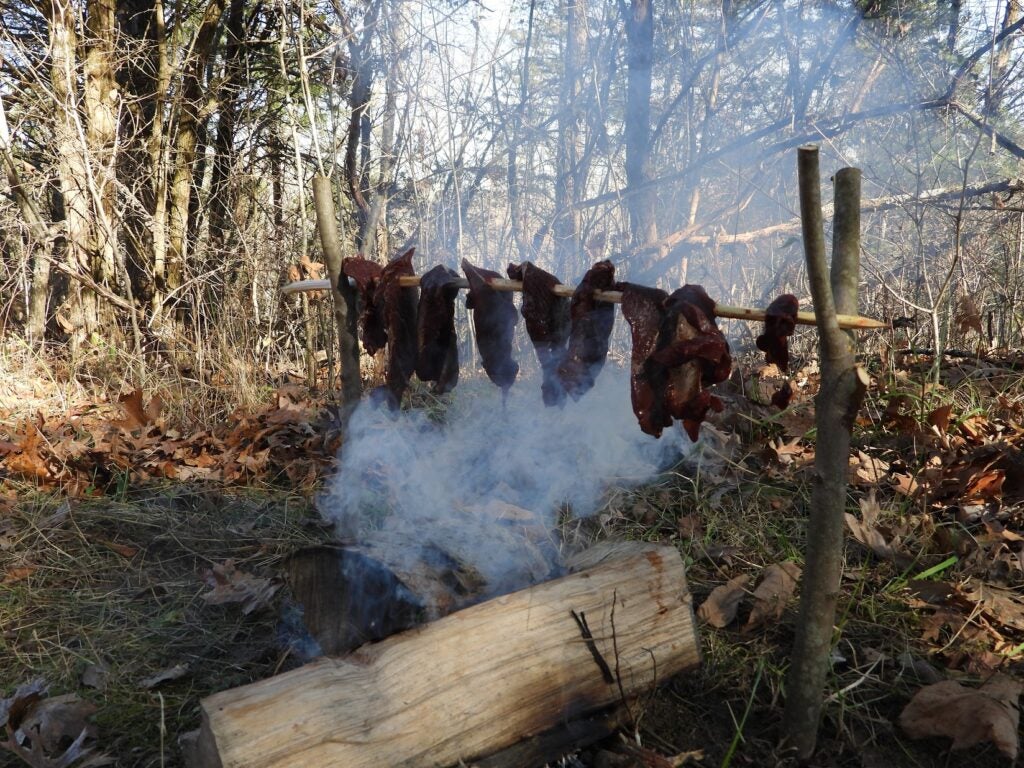 Jerky smoking over an open fire