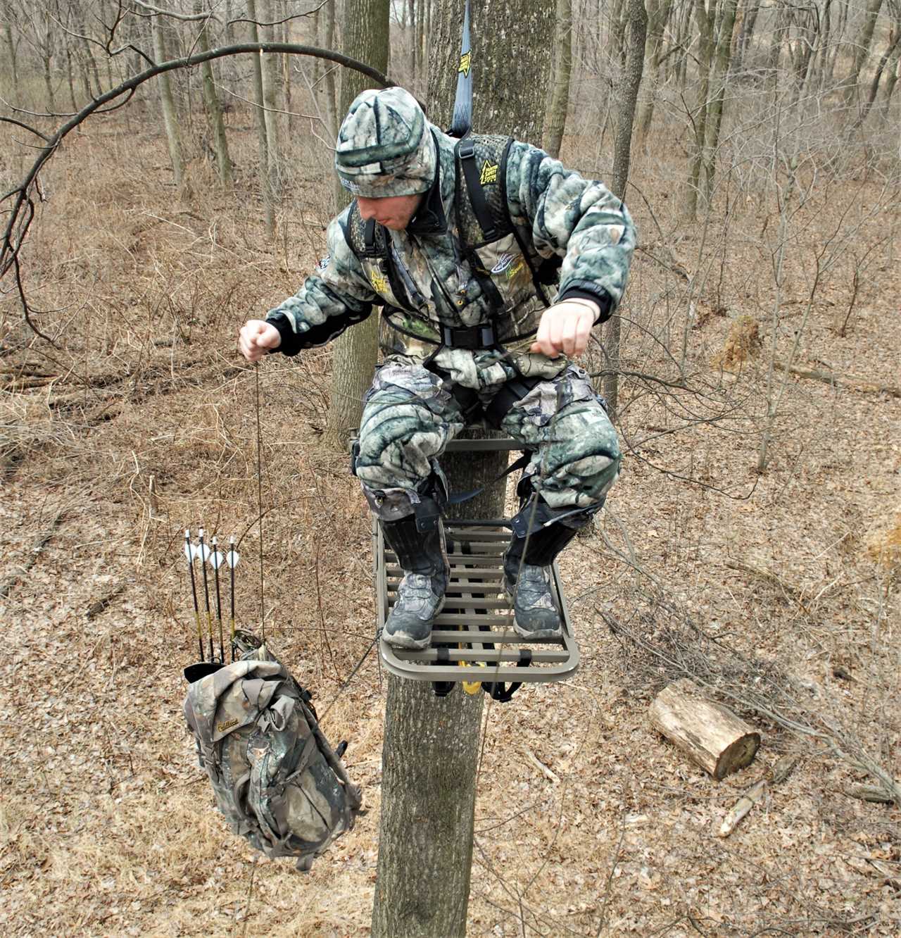 Hunter lowering their bow to the ground.