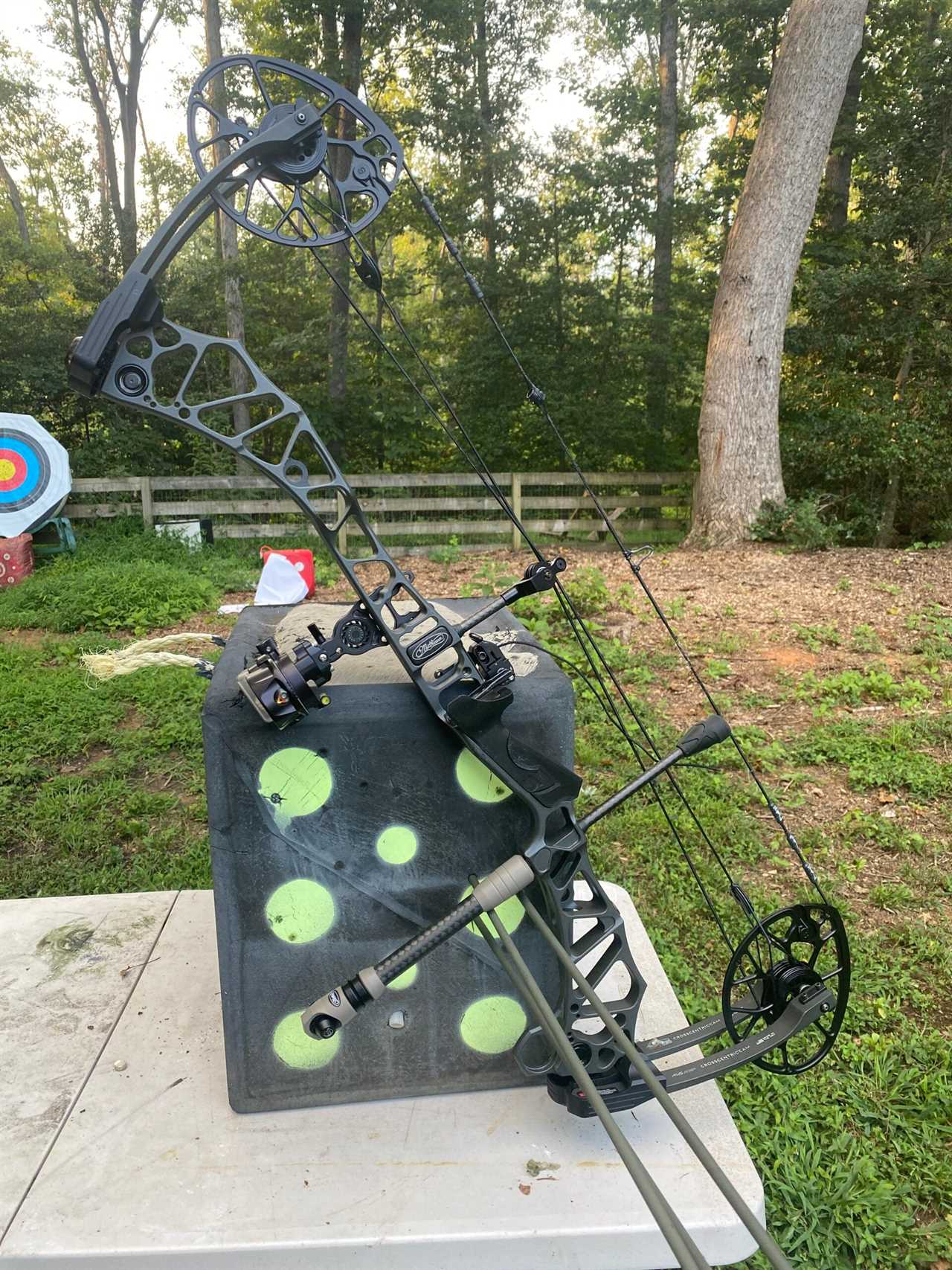 Bow used for accuracy testing leaning on target.