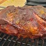 Smoky Pulled Pork Rub on pork roast on a smoker