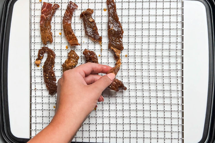 raw jerky on a wire rack