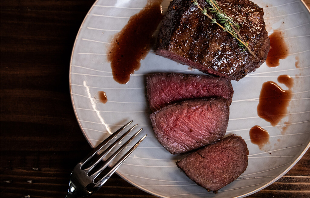 top sirloin steak cut and served on a plate