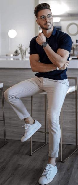 smart casual birthday outfit with a tshirt and chino accessorized with a watch and glasses. completing the look with sneakers