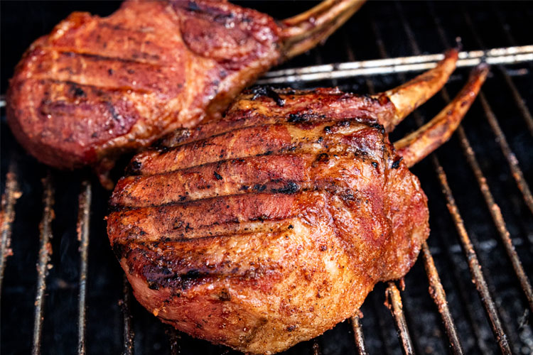 cooked pork chops on the smoker