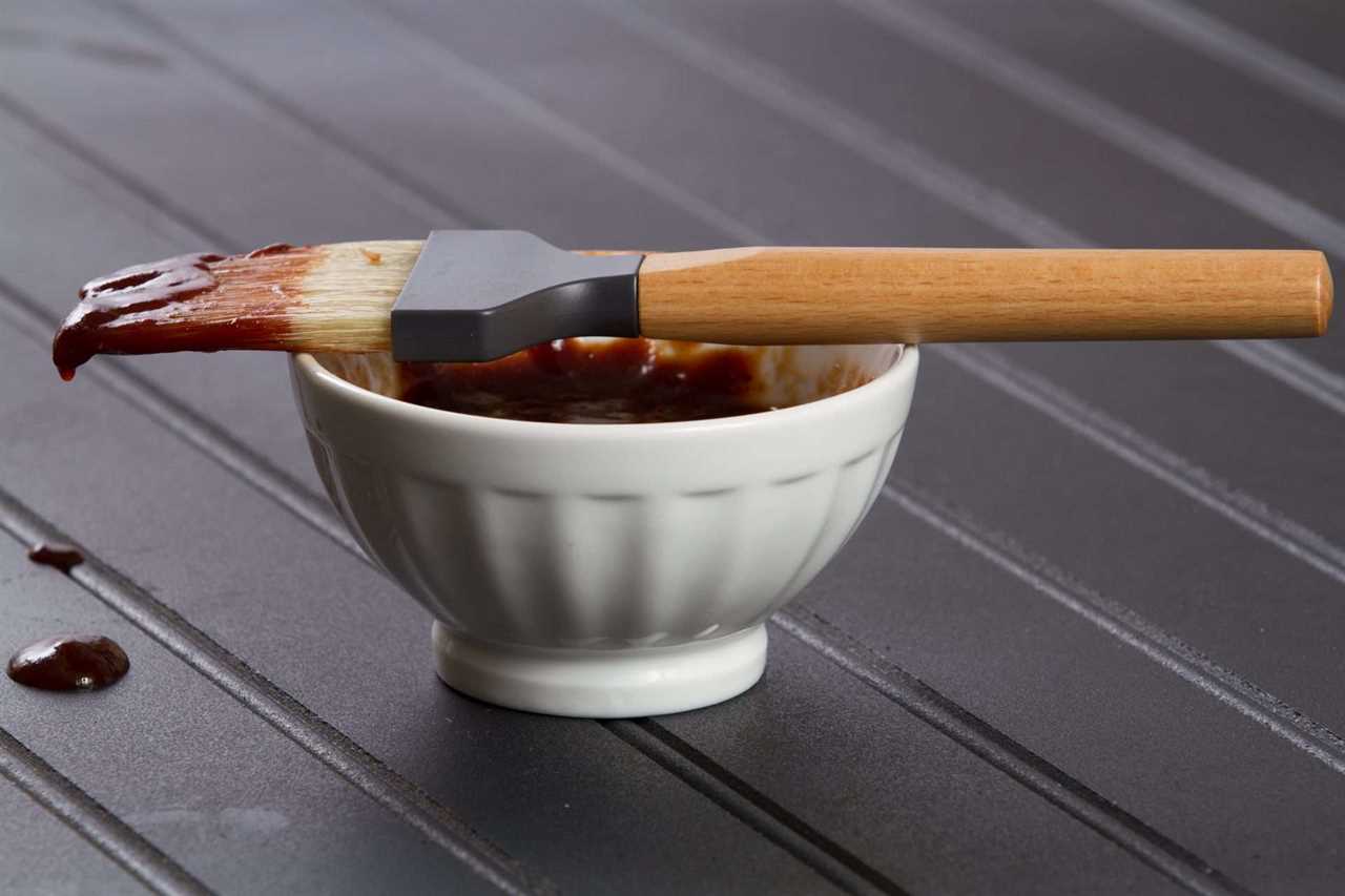 BBQ sauce in bowl with brush