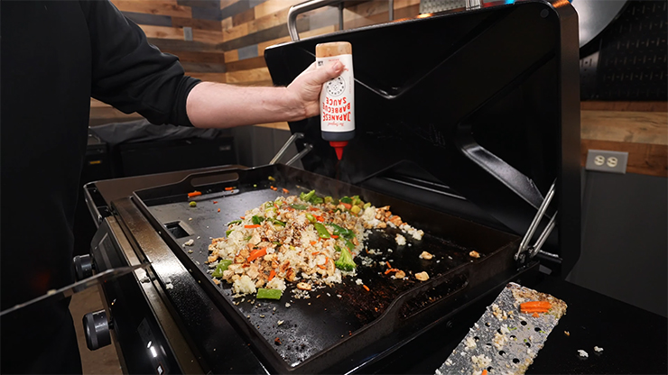 cooking chicken fried rice on the Traeger Flatrock Griddle