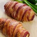 bacon wrapped jalapeno-popper-chicken-on-cutting-board