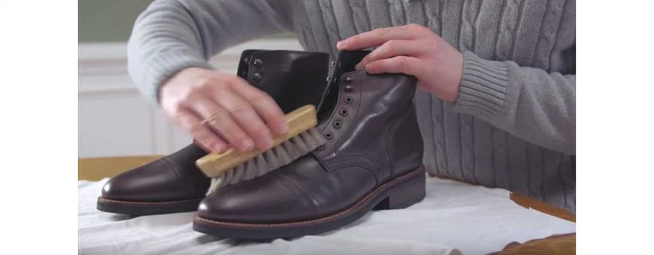 brushing leather shoes to clean