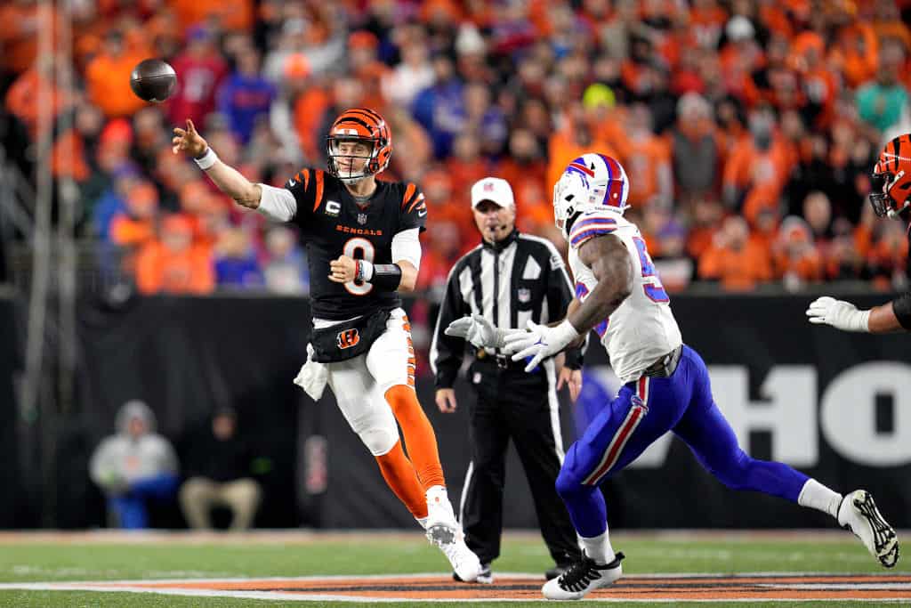 Joe Burrow #9 of the Cincinnati Bengals attempts a pass under pressure from Leonard Floyd #56 of the Buffalo Bills during the third quarter at Paycor Stadium on November 05, 2023 in Cincinnati, Ohio.