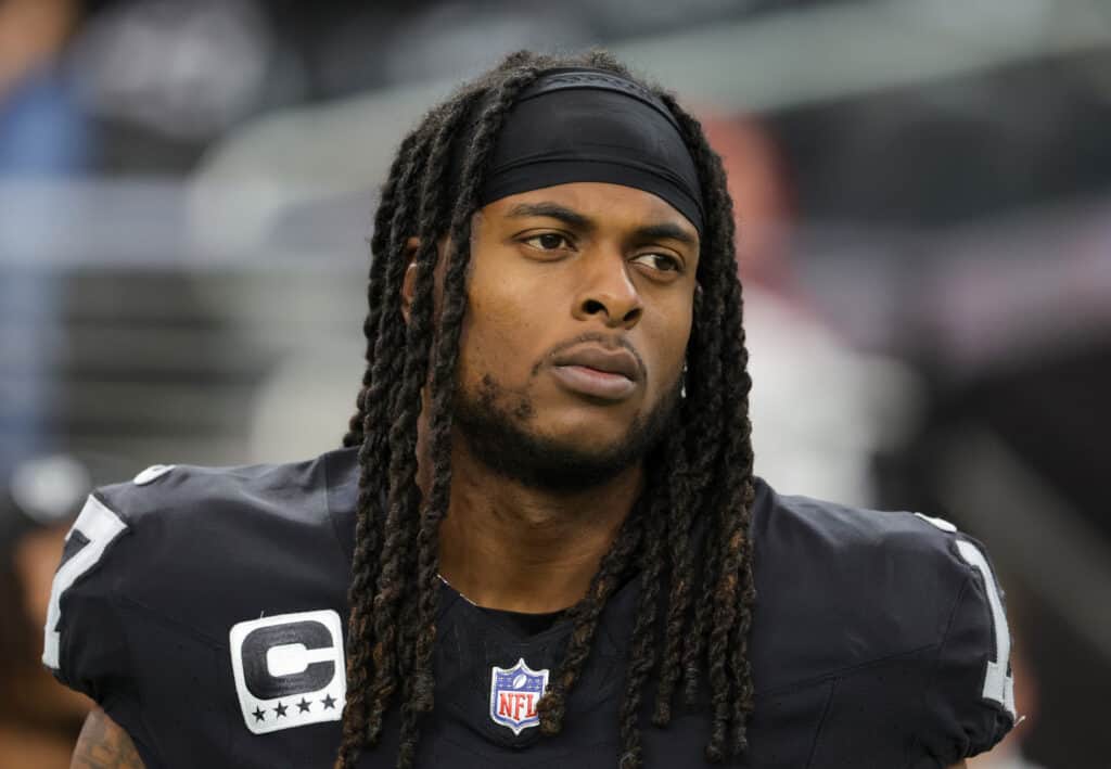 Wide receiver Davante Adams #17 of the Las Vegas Raiders looks on as the United Staes national anthem is performed before a game against the New York Giants at Allegiant Stadium on November 05, 2023 in Las Vegas, Nevada. The Raiders defeated the Giants 30-6.