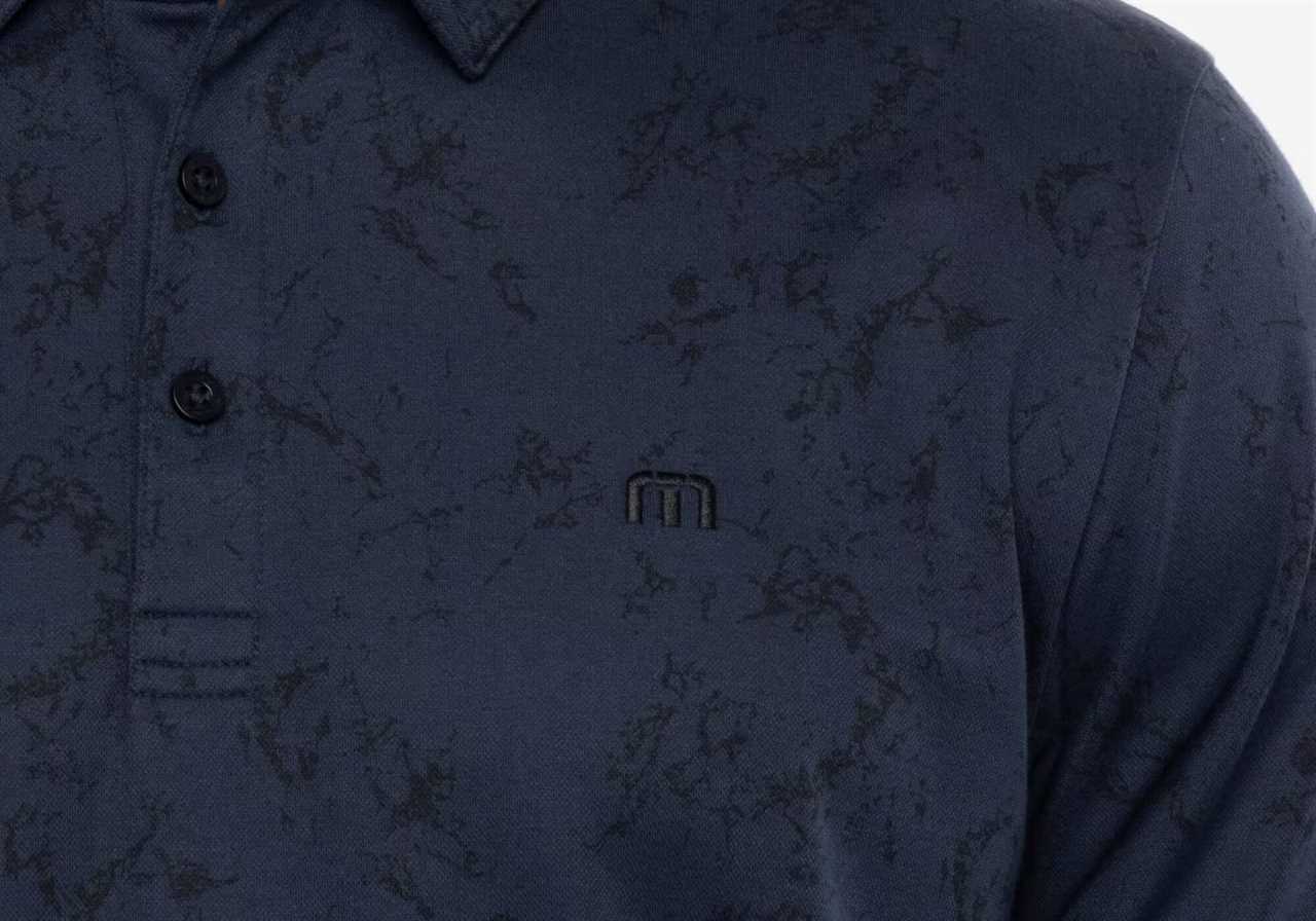 Close up of an all-over print on a Travis Mathew polo