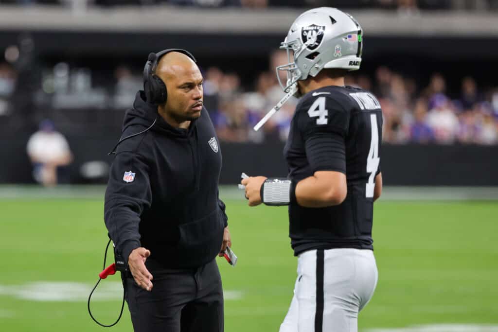 Interim head coach Antonio Pierce of the Las Vegas Raiders high-fives Aidan O'Connell #4 in the first quarter of a game against the New York Giants at Allegiant Stadium on November 05, 2023 in Las Vegas, Nevada.