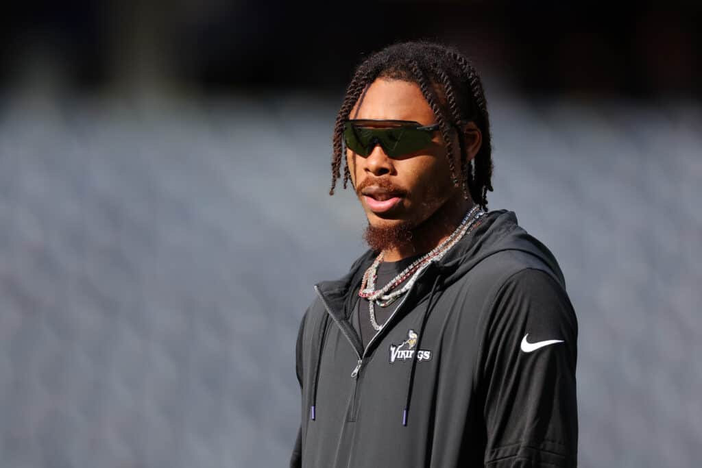 Justin Jefferson #18 of the Minnesota Vikings looks on prior to a game against the Chicago Bears at Soldier Field on October 15, 2023 in Chicago, Illinois.