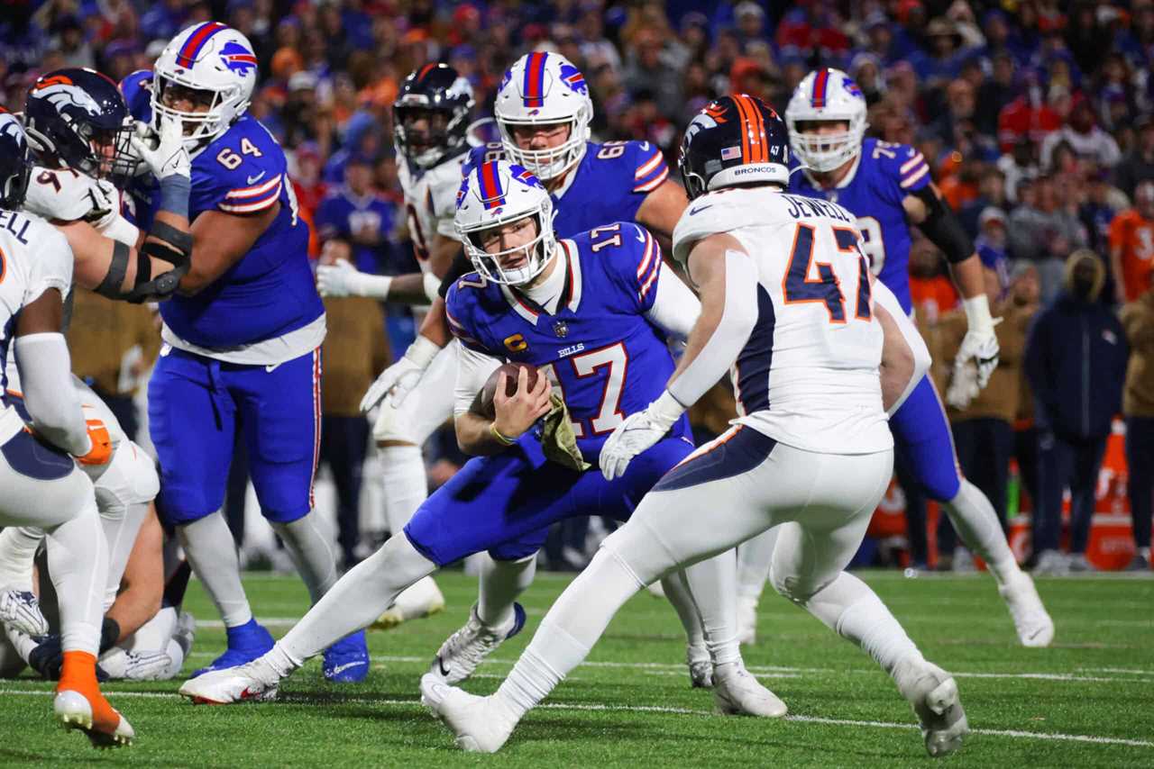 Josh Allen #17 of the Buffalo Bills carries the ball against the Denver Broncos during the third quarter of the game at Highmark Stadium on November 13, 2023 in Orchard Park, New York.