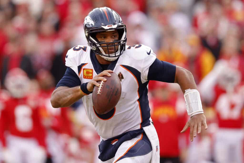 Russell Wilson #3 of the Denver Broncos rushes for a touchdown against the Kansas City Chiefs during the fourth quarter of the game at Arrowhead Stadium on January 01, 2023 in Kansas City, Missouri.