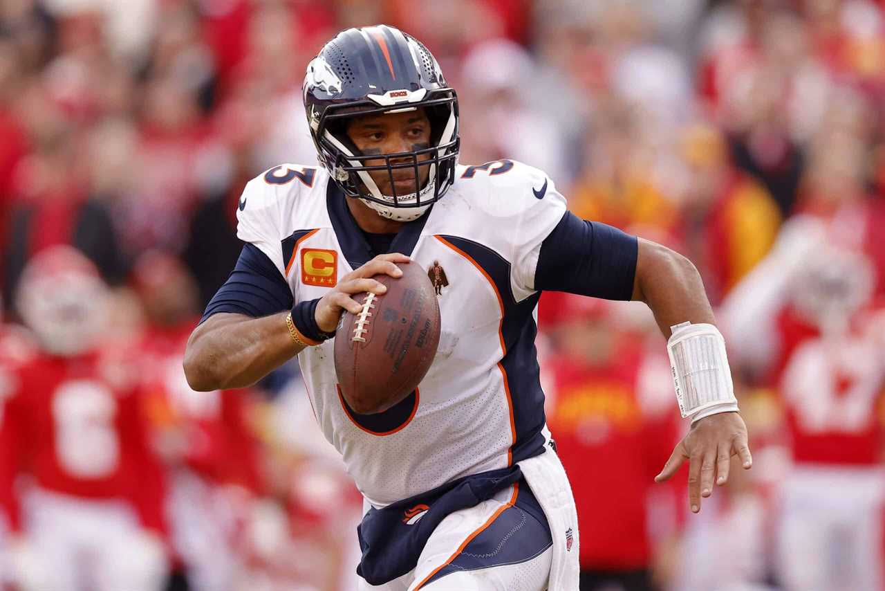 Russell Wilson #3 of the Denver Broncos rushes for a touchdown against the Kansas City Chiefs during the fourth quarter of the game at Arrowhead Stadium on January 01, 2023 in Kansas City, Missouri.