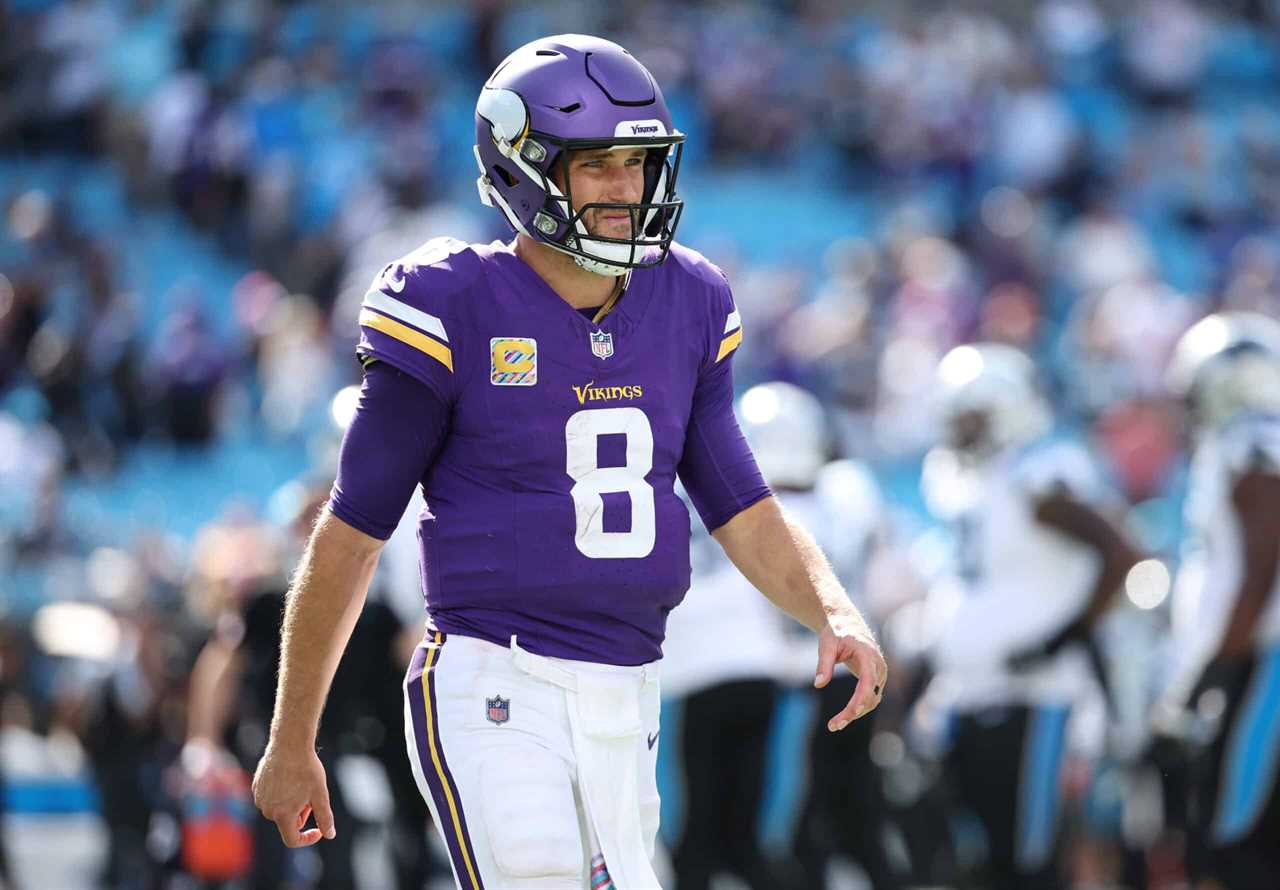 Kirk Cousins #8 of the Minnesota Vikings walks to the sidelines after calling a timeout during the fourth quarter against the Carolina Panthers at Bank of America Stadium on October 01, 2023 in Charlotte, North Carolina.