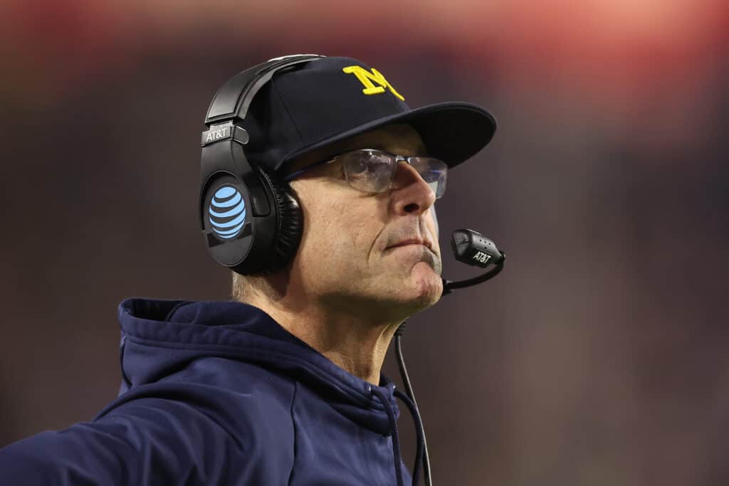 GLENDALE, ARIZONA - DECEMBER 31: Head coach Jim Harbaugh of the Michigan Wolverines looks on during the Vrbo Fiesta Bowl at State Farm Stadium on December 31, 2022 in Glendale, Arizona. The Horned Frogs defeated the Wolverines 51-45