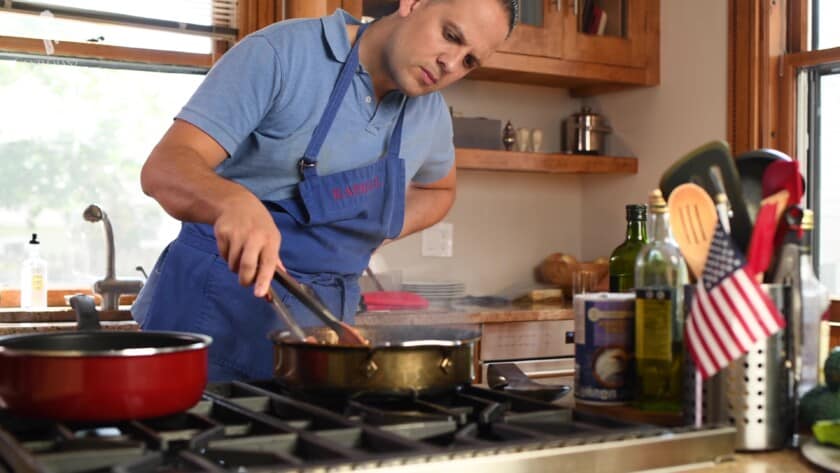 Raphael cooking at home.