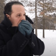 Raphael keeping warm in the cold with a black overcoat and Petrol Blue gloves from Fort Belvedere