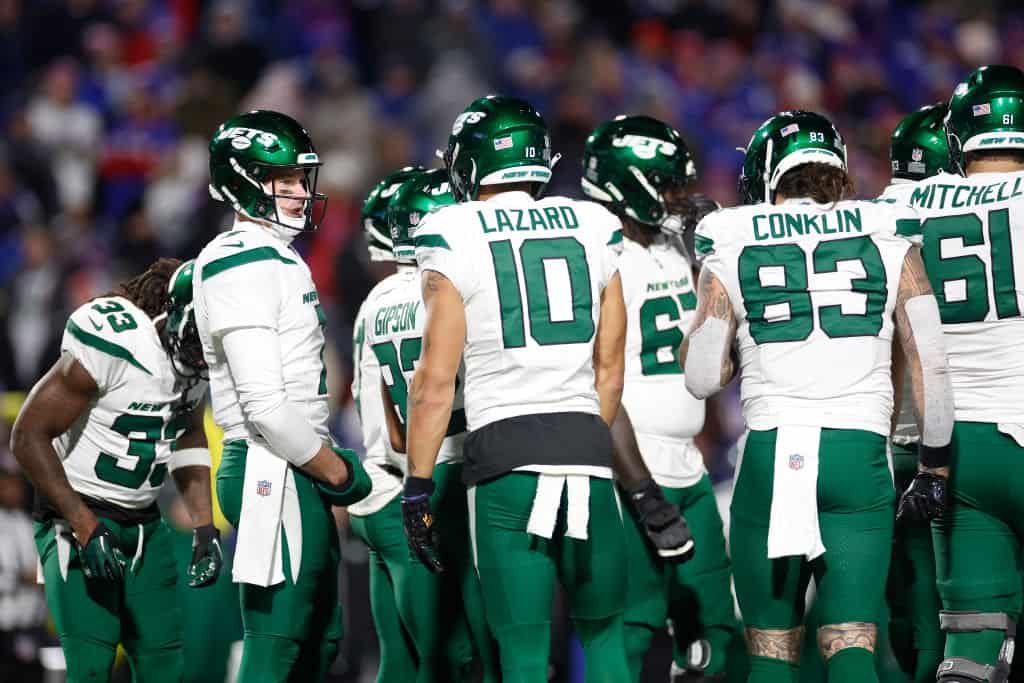 Tim Boyle #7 of the New York Jets huddles with the team in the fourth quarter against the Buffalo Bills at Highmark Stadium on November 19, 2023 in Orchard Park, New York.