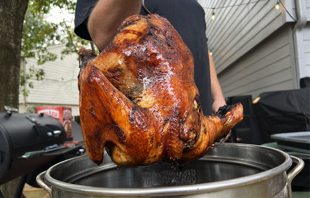 lifting deep fried turkey out of fryer