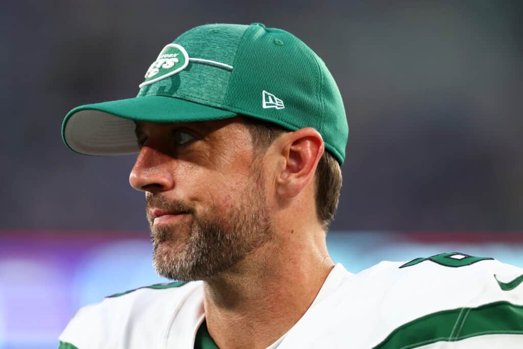 Aaron Rodgers #8 of the New York Jets looks on from the sideline during a preseason game against the New York Giants at MetLife Stadium on August 26, 2023 in East Rutherford, New Jersey.
