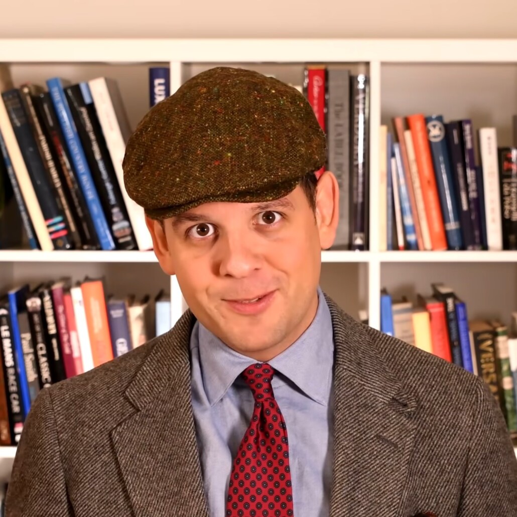 Photo of Mottled green flat cap worn with gray diagonal weave jacket