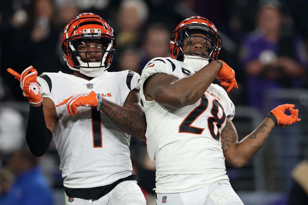 Joe Mixon #28 of the Cincinnati Bengals celebrates with Ja'Marr Chase #1 after scoring a touchdown against the Baltimore Ravens during the second quarter of the game at M&T Bank Stadium on November 16, 2023 in Baltimore, Maryland.