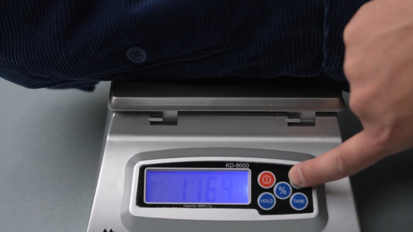 Photo of Weighing corduroy fabric