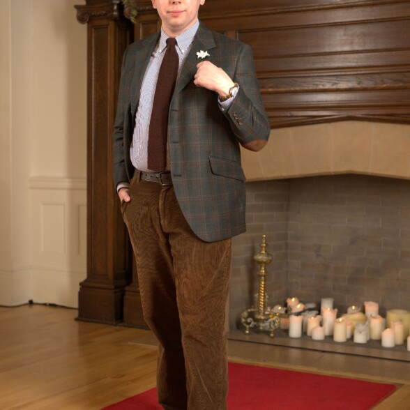 Photo of a man wearing odd jacket with corduroy trousers