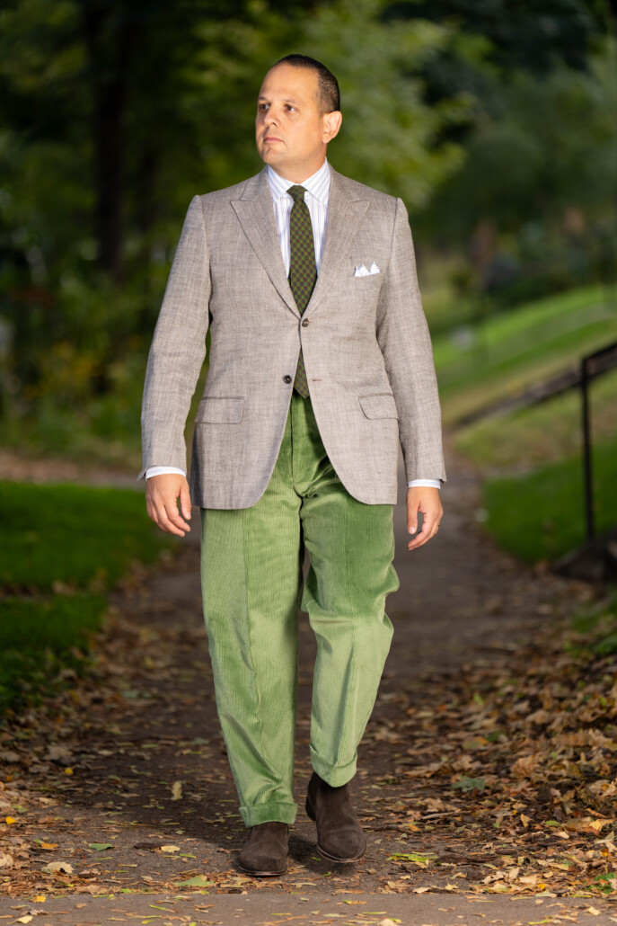 Photo of Raphael wearing Sage Green corduroy with gray sport coat and green tie