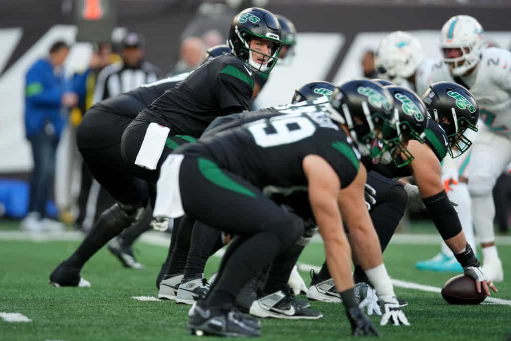Tim Boyle #7 of the New York Jets hikes the ball against the Miami Dolphins during the first quarter in the game at MetLife Stadium on November 24, 2023 in East Rutherford, New Jersey.