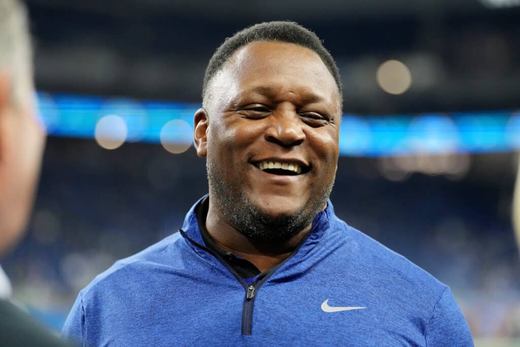 Former Detroit Lions player Barry Sanders walk on the field before the game between Detroit Lions and Seattle Seahawks at Ford Field on September 17, 2023 in Detroit, Michigan.