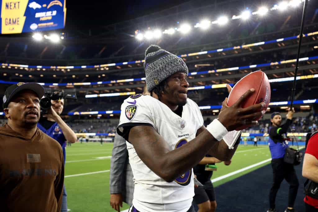 INGLEWOOD, CALIFORNIA - NOVEMBER 26: Lamar Jackson #8 of the Baltimore Ravens celebrates after defeating the Los Angeles Chargers in the game at SoFi Stadium on November 26, 2023 in Inglewood, California.