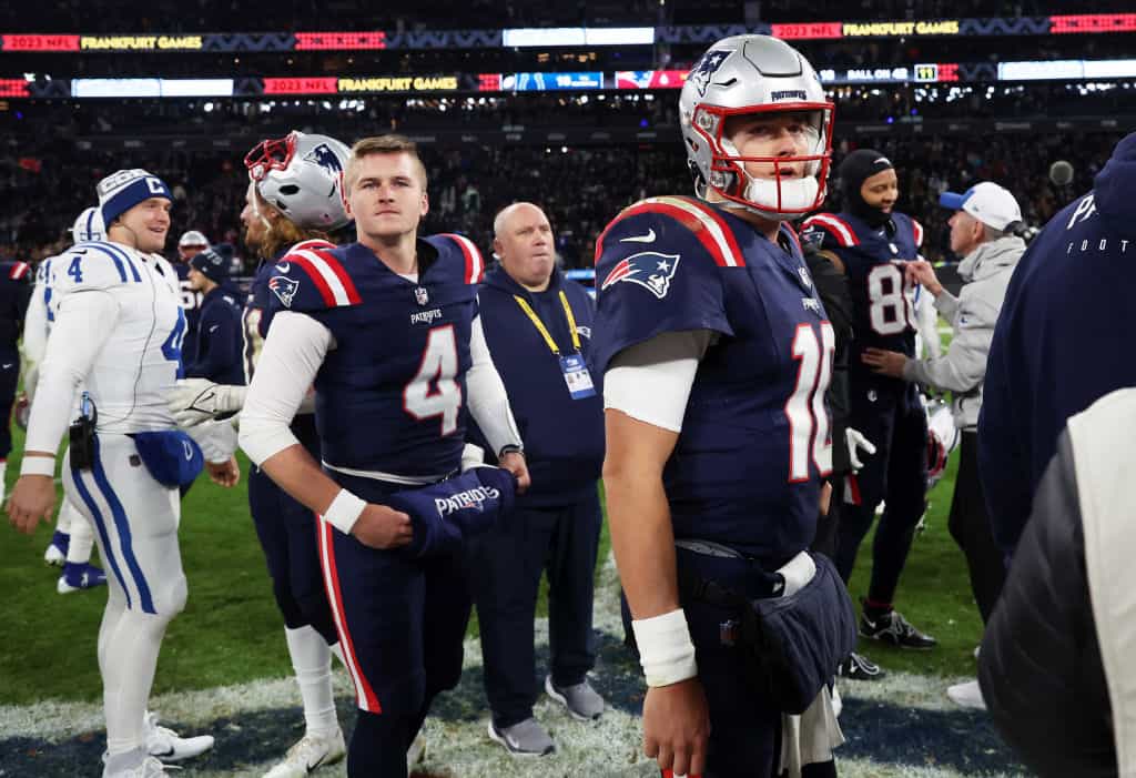 Bailey Zappe #4 of the New England Patriots and Mac Jones #10 of the New England Patriots look dejected following the team's 10-6 defeat during the NFL match between the Indianapolis Colts and the New England Patriots at Deutsche Bank Park on November 12, 2023 in Frankfurt am Main, Germany.