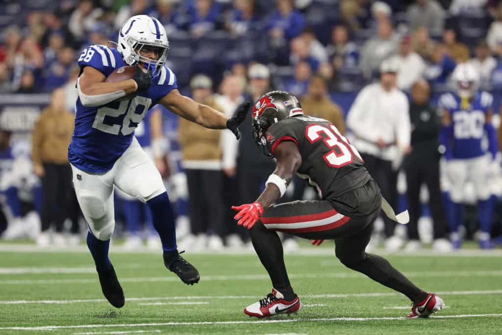 Jonathan Taylor #28 of the Indianapolis Colts carries the ball in the second half of the game against the Tampa Bay Buccaneers at Lucas Oil Stadium on November 26, 2023 in Indianapolis, Indiana.