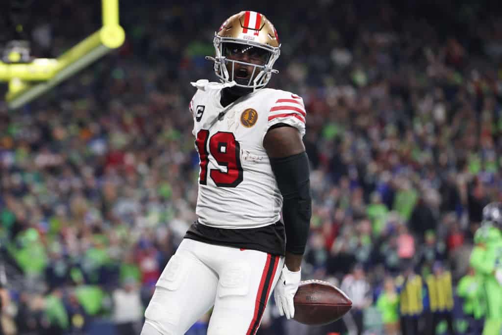 Deebo Samuel #19 of the San Francisco 49ers scores a touchdown against the Seattle Seahawks during the first quarter at Lumen Field on November 23, 2023 in Seattle, Washington.