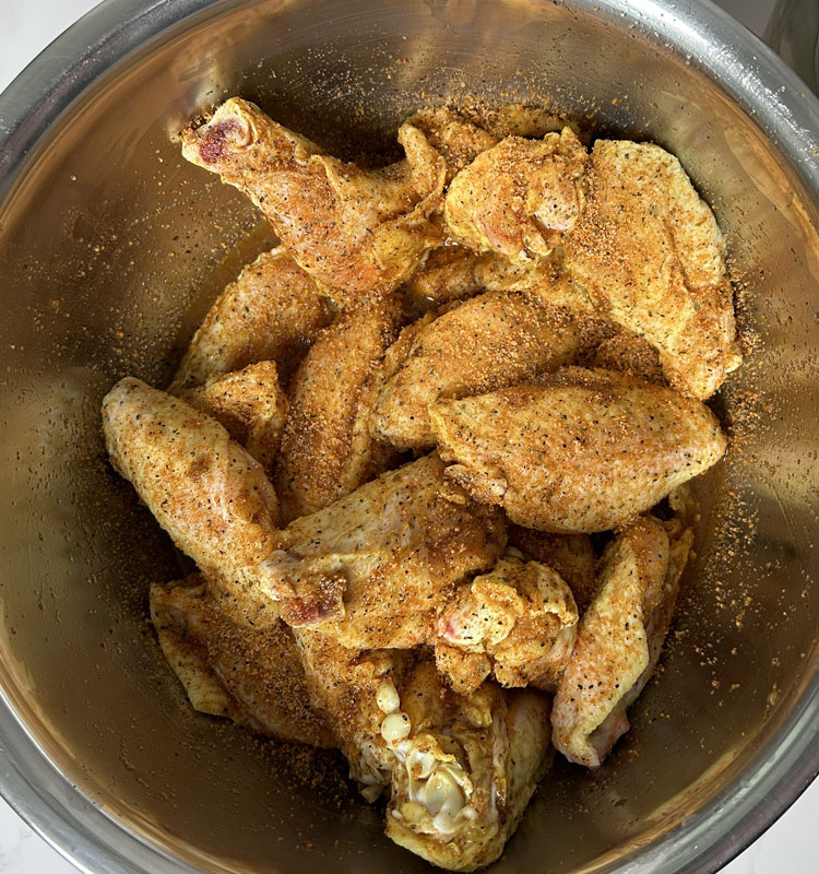 pickleback wings with seasoning in a metal bowl