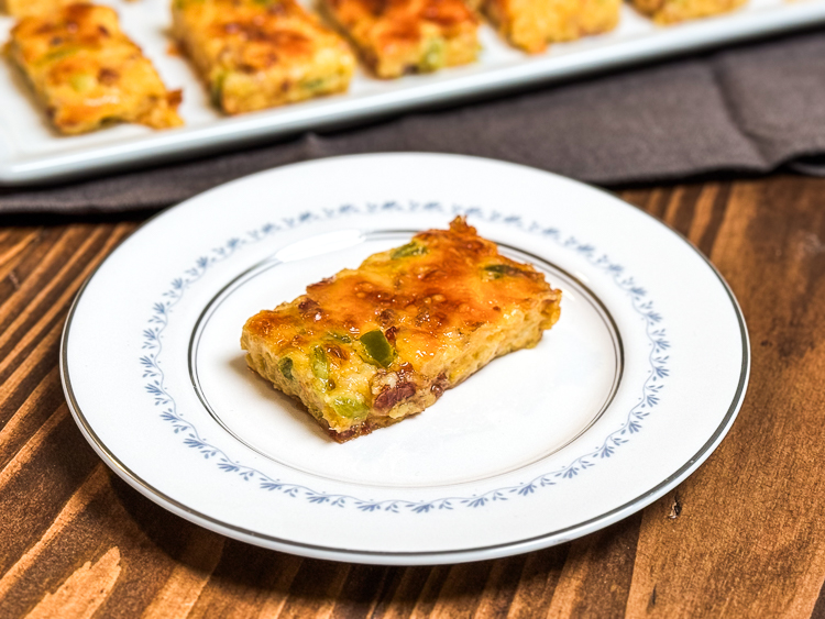 a slice of jalapeno cheese square on a white plate