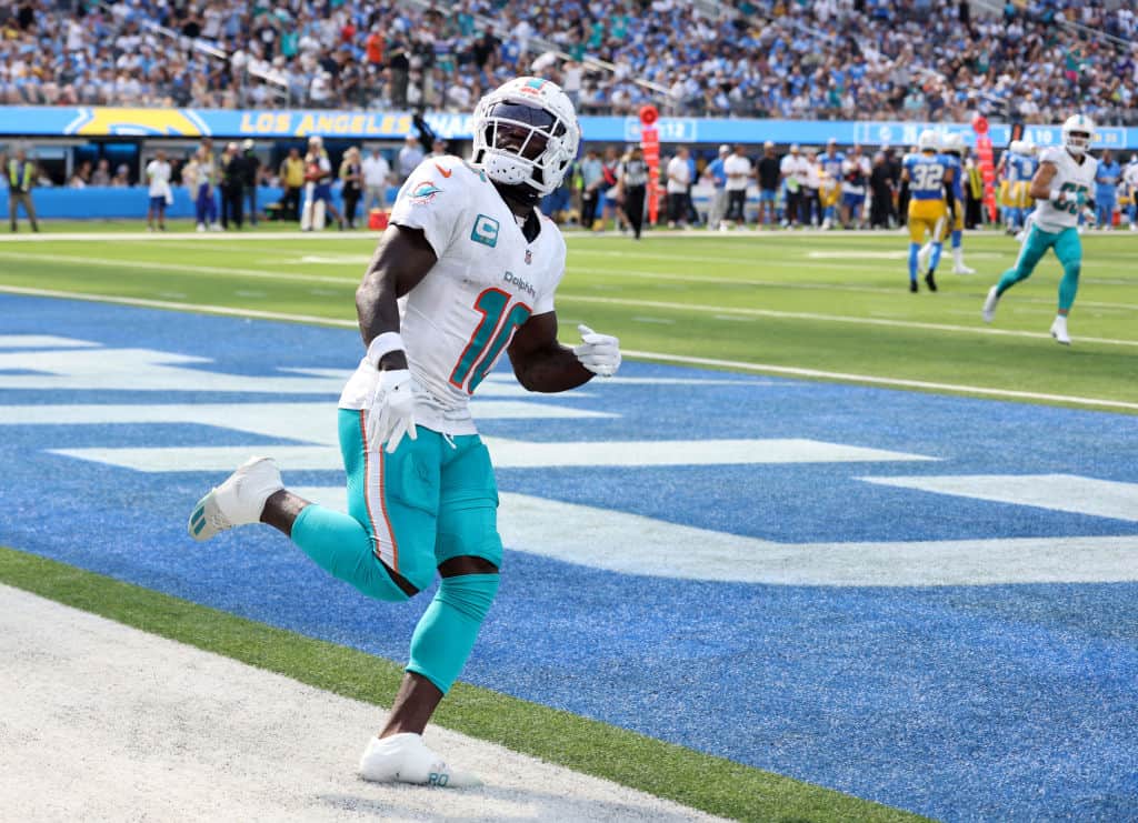 Tyreek Hill #10 of the Miami Dolphins celebrates his touchdown, to take a 27-24 lead in the third quarter, during a 36-34 Dolphins win over the Los Angeles Chargers at SoFi Stadium on September 10, 2023 in Inglewood, California.