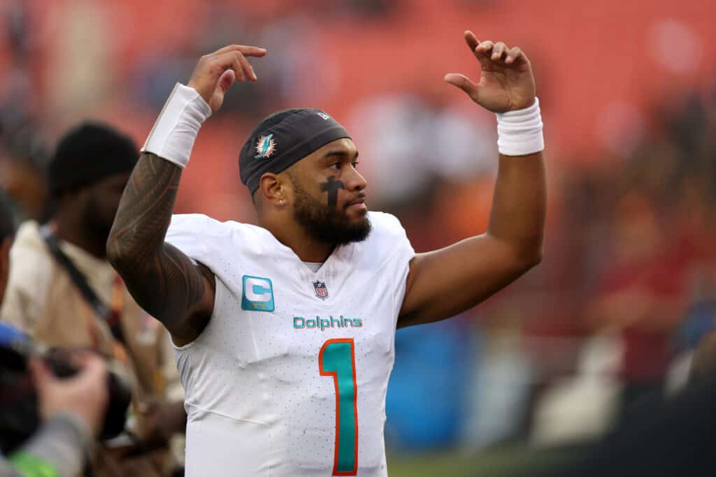 LANDOVER, MARYLAND - DECEMBER 03: Quarterback Tua Tagovailoa #1 of the Miami Dolphins celebrates following the Dolphins win over the Washington Commanders at FedExField on December 03, 2023 in Landover, Maryland.