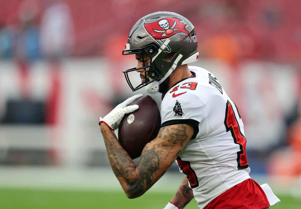 TAMPA, FLORIDA - DECEMBER 03: Mike Evans #13 of the Tampa Bay Buccaneers warms up prior to a game against the Carolina Panthers at Raymond James Stadium on December 03, 2023 in Tampa, Florida.